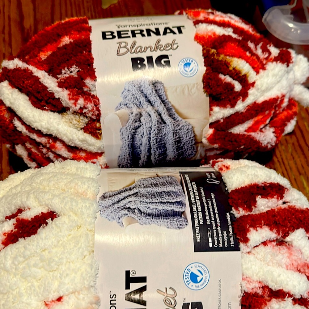 2 skeins of bernat blanket big yarn red and whitete color